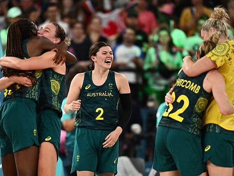 Australia's Jade Melbourne (centre) and teammates celebrate after they won the women's Bronze Medal basketball match against Belgium during the Paris 2024 Olympic Games at the Bercy Arena in Paris on Sunday.