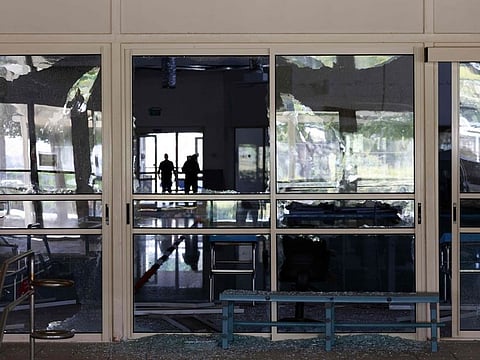 People check the damage at the therapeutic rehabilitation centre for the the disabled in Israel's Mevo'ot HaHermon Regional Council in the Upper Galilee on August 11, 2024, a day after it was hit by shrapnel from Israeli interception of drones fired from southern Lebanon.