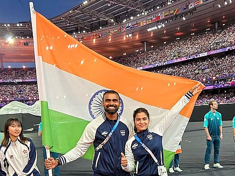 India’s flagbearers PR Sreejesh (left) and Manu Bhaker at the closing ceremony of Paris Olympics 2024 at Stade de France in Paris on August 11, 2024. Both won bronze medals.