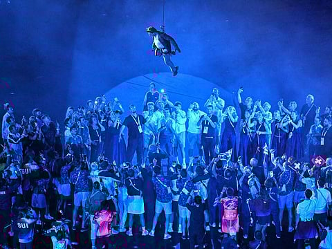 US' actor Tom Cruise descends from the roof of the stadium during the closing ceremony of the Paris 2024 Olympic Games at the Stade de France, in Saint-Denis, in the outskirts of Paris, on August 11, 2024.