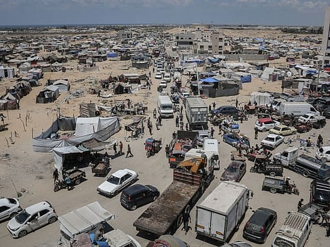Displaced Palestinians flee following evacuation orders from the Israeli army to leave the Hamad district of Khan Younis, southern Gaza, on August 11, 2024.
