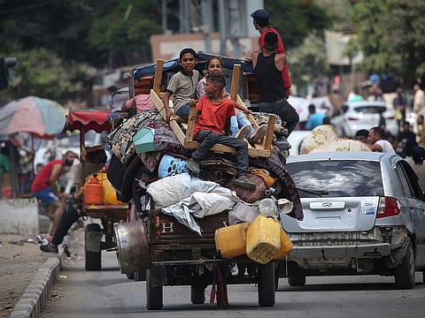 Palestinians flee with their belongings Deir El Balah in the central Gaza Strip on August 16, 2024, amid the ongoing conflict between Israel and the Hamas militant group.