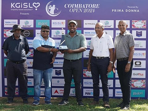 Rayhan Thomas receives his trophy after his victory
