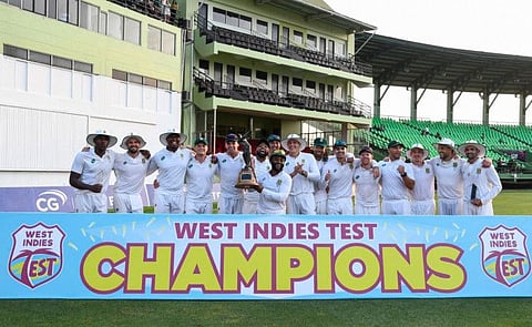 South Africa team pose with the trophy after winning on Day 3 of the 2nd Test match between West Indies and South Africa at Guyana National Stadium in Providence, Guyana, on Saturday..
