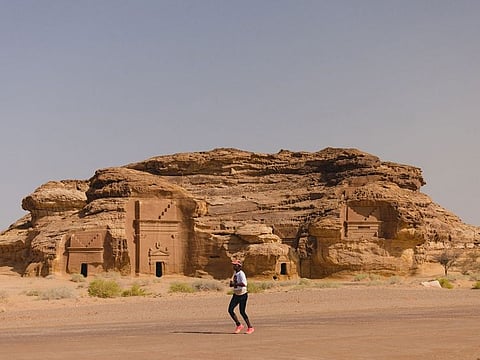 An athlete running at Hegra during the first edition of AlUla Desert Blaze 2023.