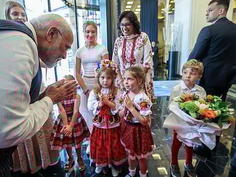 Prime Minister Narendra Modi receives a warm welcome on his arrival, at a hotel, in Warsaw on Wednesday.