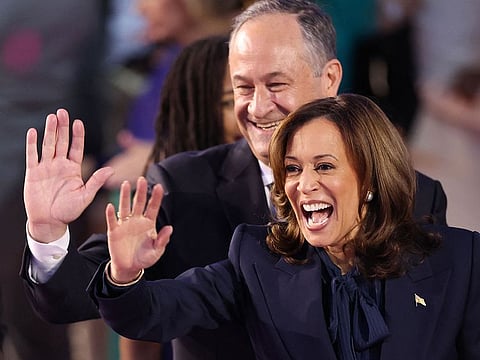 US Vice-President and 2024 Democratic presidential candidate Kamala Harris and her husband US Second Gentleman Douglas Emhoff wave from the stage on the fourth and last day of the Democratic National Convention (DNC) at the United Centre in Chicago, Illinois, on August 22, 2024.