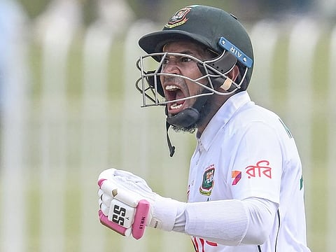 Bangladesh's Mushfiqur Rahim celebrates after scoring a century during the fourth day of the first Test match against Pakistan at the Rawalpindi Cricket Stadium in Rawalpindi on August 24, 2024.