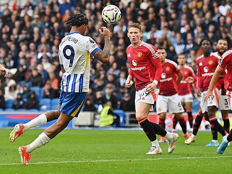 Brighton's Joao Pedro heads the ball to score team's second goal during the English Premier League match against Manchester United at the American Express Community Stadium in Brighton, southern England on August 24, 2024.
