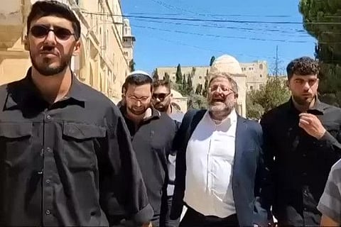 This image grab taken from a UGC video footage posted on August 13, 2024 shows Israel's National Security Minister Itamar Ben Gvir (2nd right) chanting the slogan "Am Yisrael Chai" (the people of Israel live) during a visit with others to the Aqsa mosque compound in Jerusalem's Old City to mark the Jewish holiday of Tisha B'Av. The far-right Israeli minister prayed at the site in annexed east Jerusalem on August 13, defying a ban on Jewish prayer at the flashpoint site and drawing global condemnation.