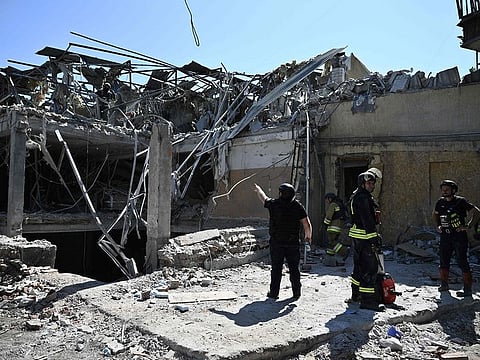 Ukrainian emergency services carry out a search and rescue operation among the rubble of a destroyed hotel after a strike in the town of Kramatorsk, Donetsk region on August 25, 2024.