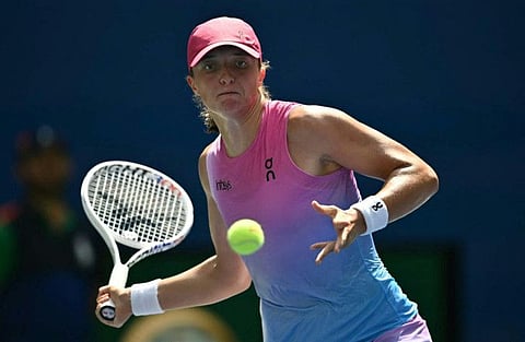 Poland's Iga Swiatek plays against Russia's Kamilla Rakhimova during their women's singles first round match on day two of the US Open tennis tournament at the USTA Billie Jean King National Tennis Centre in New York City, on Tuesday.