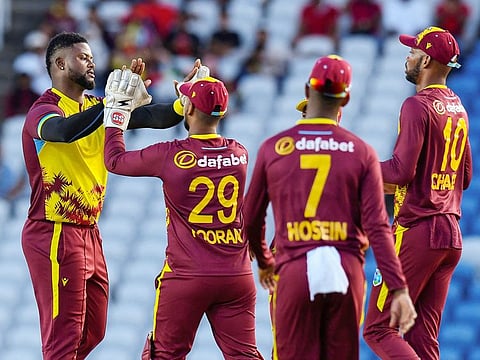 Romario Shepherd (L) of West Indies celebrates the dismissal of Aiden Markram of South Africa during the 3rd and final T20I match at Brian Lara Cricket Academy in Tarouba, Trinidad and Tobago, on August 27, 2024.