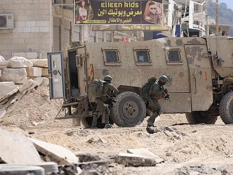 Israeli soldiers operate during a raid in the Nur Shams camp for Palestinian refugees near the city of Tulkarem in the Israeli-occupied West Bank on August 28, 2024.