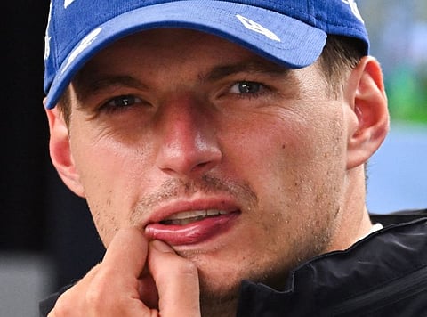 Red Bull Racing's Dutch driver Max Verstappen looks on in the paddock ahead of the first practice session at The Circuit Zandvoort, western Netherlands, on August 23.