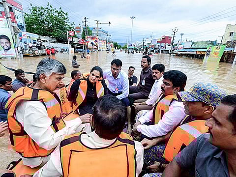 Andhra Pradesh Chief Minister N Chandrababu Naidu visits the flood-affected areas at Budameru in Vijayawada on Sunday.