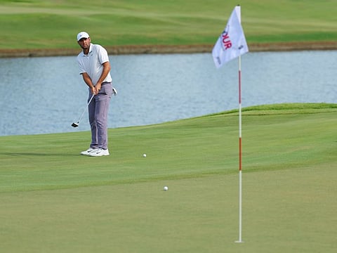 Scottie Scheffler of the United States putts on the ninth green during the third round of the Tour Championship at East Lake Golf Club on Saturday,