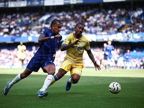 Chelsea's French defender Malo Gusto vies for the ball with Crystal Palace's US defender Chris Richards during the English Premier League football match at Stamford Bridge in London on Sunday.