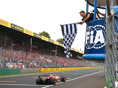 Ferrari's Monegasque driver Charles Leclerc drives past the chequered flag to win the Italian Formula One Grand Prix race at Autodromo Nazionale Monza circuit, in Monza on Sunday.