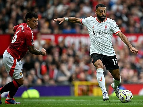 Liverpool's Egyptian striker Mohamed Salah crosses the ball during the English Premier League football match against Manchester United at Old Trafford in Manchester, north west England, on Sunday.