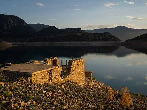 The remnants of a house that reappeared when the level of the Mornos artificial lake dropped following a drought, near the village of Lidoriki, about 240km northwest of Athens, on September 1, 2024.