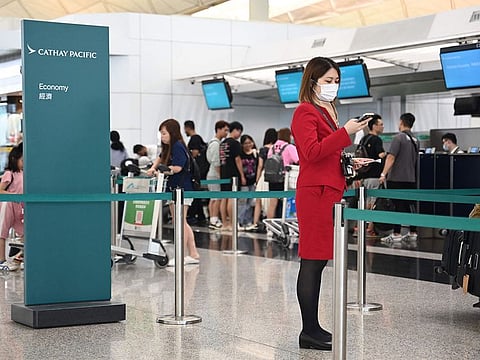 A Cathay Pacific staff is seen at the international airport in Hong Kong on September 4, 2024.