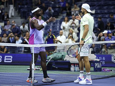 Frances Tiafoe of the United States shakes hands with Grigor Dimitrov of Bulgaria after winning their men's singles quarter-final match of the 2024 US Open at USTA Billie Jean King National Tennis Center on Tuesday.