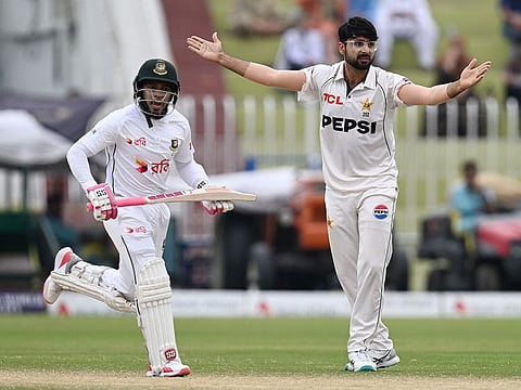 Pakistan's Abrar Ahmed (R) makes an unsuccessful leg before wicket appeal against Bangladesh's Mushfiqur Rahim (L) during the fifth and final day of the second and last Test match, at the Rawalpindi Cricket Stadium in Rawalpindi on September 3, 2024.
