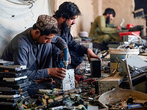 Afghan smelters extract gold from cameras and car navigation screen devices at a workshop near the Afghanistan-Pakistan border in Spin Boldak district, Kandahar province.