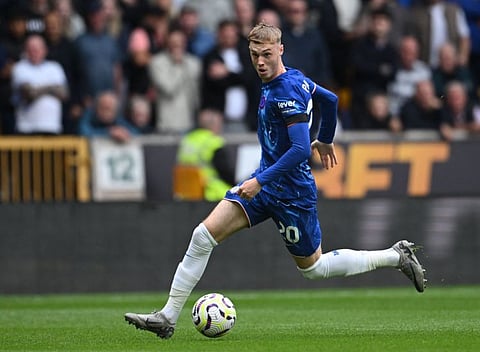 Chelsea's English midfielder Cole Palmer runs with the ball during the English Premier League football match against Wolverhampton Wanderers at the Molineux stadium in Wolverhampton, central England on August 25.