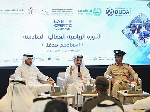From left: Major General Obaid Muhair bin Suroor, Chairman of the Permanent Committee of Labour Affairs in Dubai, Saeed Hareb, Secretary General of the Dubai Sports Council and Brigadier Ali Khalfan Al Mansouri, Director of the General Department of Community Happiness at Dubai Police.