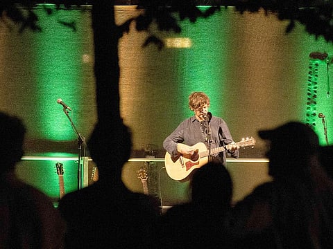 Austrian pop song-writer Nino Mandl, better known as "Nino from Vienna", performs to the crowd of several hundreds of music fans during his open-air concert at the Vienna Central Cemetery in Vienna, Austria, on Semptember 6, 2024, on the 150th anniversary of the cemetery.