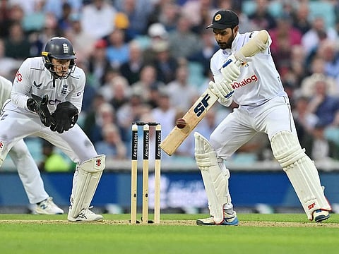 Sri Lanka's captain Dhananjaya de Silva plays a shot on day two of the thrid Test against England at The Oval cricket ground in London on September 7, 2024.