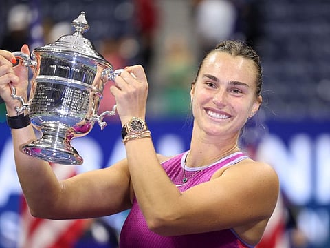 Aryna Sabalenka of Belarus celebrates with the trophy after defeating Jessica Pegula of the United States to win the women's singles final of the 2024 US Open at USTA Billie Jean King National Tennis Centre on Saturday.
