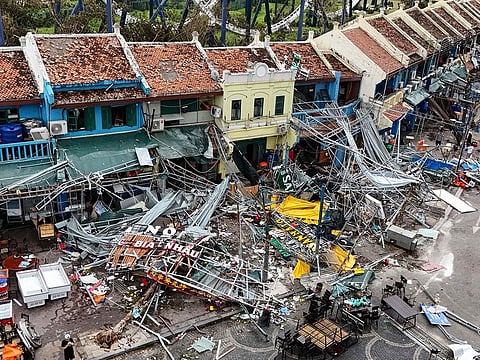 Damaged buildings and debris on a street after Super Typhoon Yagi hit Ha Long, in Quang Ninh province.