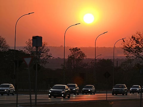 The sun sets in Brasilia, Brazil, amid smoke from forest fires in the northern and central western states, on September 9, 2024.