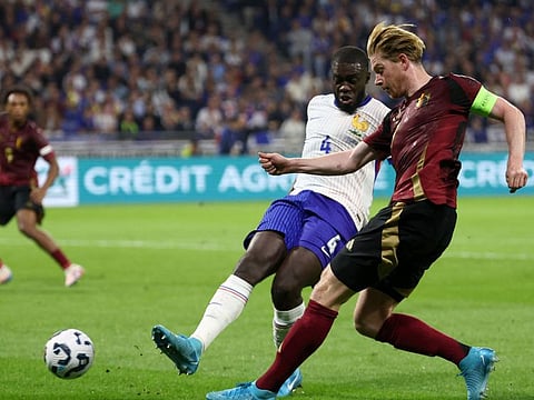 Belgium's midfielder Kevin De Bruyne (right) and France's defender Dayot Upamecano fight for the ball during the Uefa Nations League, League A - Group 2 first leg football match at the Parc Olympique Lyonnais in Lyon on September 9.