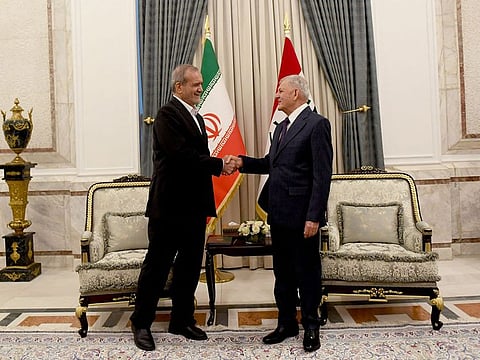 Iraq's President Abdul Latif Rashid (R) meeting with his counterpart from Iran Masoud Pezeshkian in Baghdad.