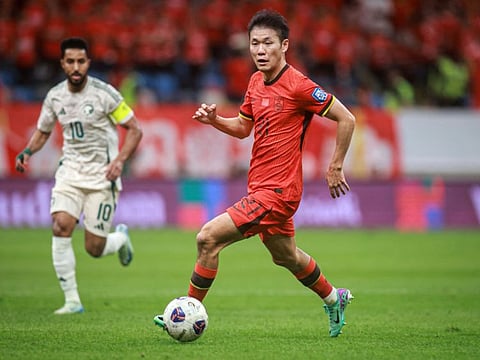 China's Li Yuanyi controls the ball during the 2026 Fifa World Cup qualifier football match against Saudi Arabia in Dalian, in northwestern Chinas Liaoning province on Tuesday.