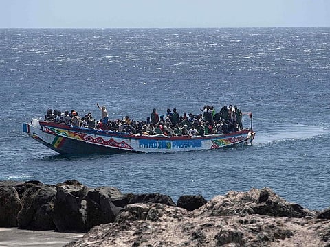 A 'cayuco' boat carrying African migrant people, part of a group of 386 migrants onboard of two boats, arrives at La Restinga port on the Canary island of El Hierro on August 28, 2024