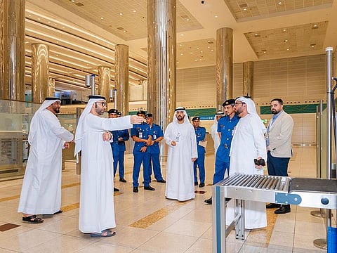 Dr. Abdulla Mohammed Busenad, Director General of Dubai Customs, and other officials inspecting Customs operations at Dubai airport.
