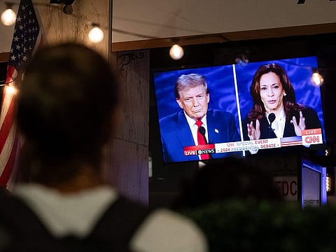 A screen display the US Presidential debate between Vice President and Democratic presidential candidate Kamala Harris and former US President and Republican presidential candidate Donald Trump at The Admiral in Washington, DC, on September 10, 2024.