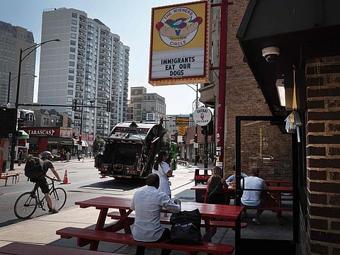 A sign at The Wieners Circle, a popular hot dog restaurant, reads "IMMIGRANTS EAT OUR DOGS" as it comments on a statement made by Republican presidential candidate, former President Donald Trump during his Tuesday-night debate against Democratic presidential nominee, U.S. Vice President Kamala Harris on September 12, 2024 in Chicago, Illinois.