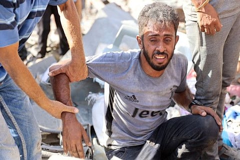 A Palestinian man reacts at the site of an Israeli strike in the Shejaiya suburb east of Gaza City on September 12, 2024, amid the ongoing war between Israel and Palestinian militants.