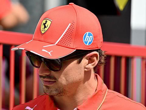 Ferrari's Charles Leclerc walks down the paddock ahead of the Formula One Azerbaijan Grand Prix in Baku.