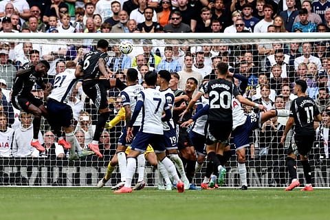 Arsenal's Brazilian defender Gabriel Magalhaes (3L) scores the team's first goal during the English Premier League football match against Tottenham Hotspur at the Tottenham Hotspur Stadium in London, on Sunday.