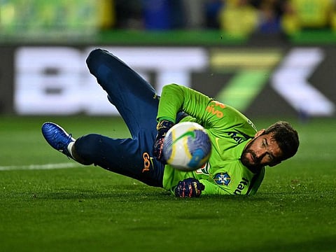 Brazil's goalkeeper Alisson during a warm-up before the 2026 World Cup South American qualifiers football match against Ecuador in Curitiba, Brazil, on September 6.