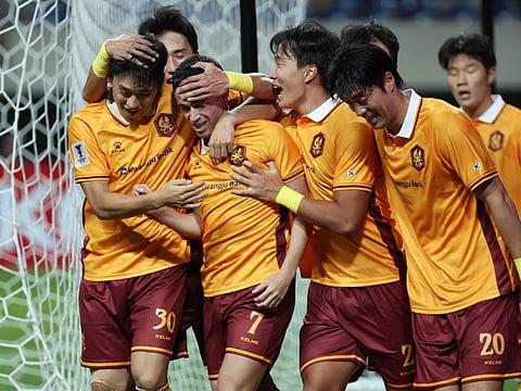 South Koreas Gwangju players celebrate after scoring a goal against Japans Yokohama F. Marinos during their Asian Champions League Elite (ACLE) stage football match at Gwangju World Cup Stadium in Gwangju on Tuesday.