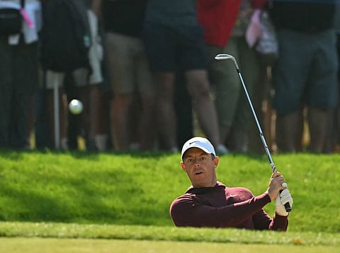 Northern Ireland's Rory McIlroy plays from a green-side bunker on the 15th hole on the opening day of the BMW PGA Championship at Wentworth Golf Club, south-west of London, on Thursday.