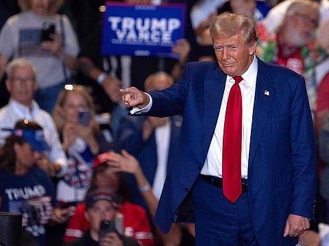 Former US President and Republican presidential candidate Donald Trump acknowledges the crowd during a campaign rally in Uniondale, New York, on September 18, 2024.
